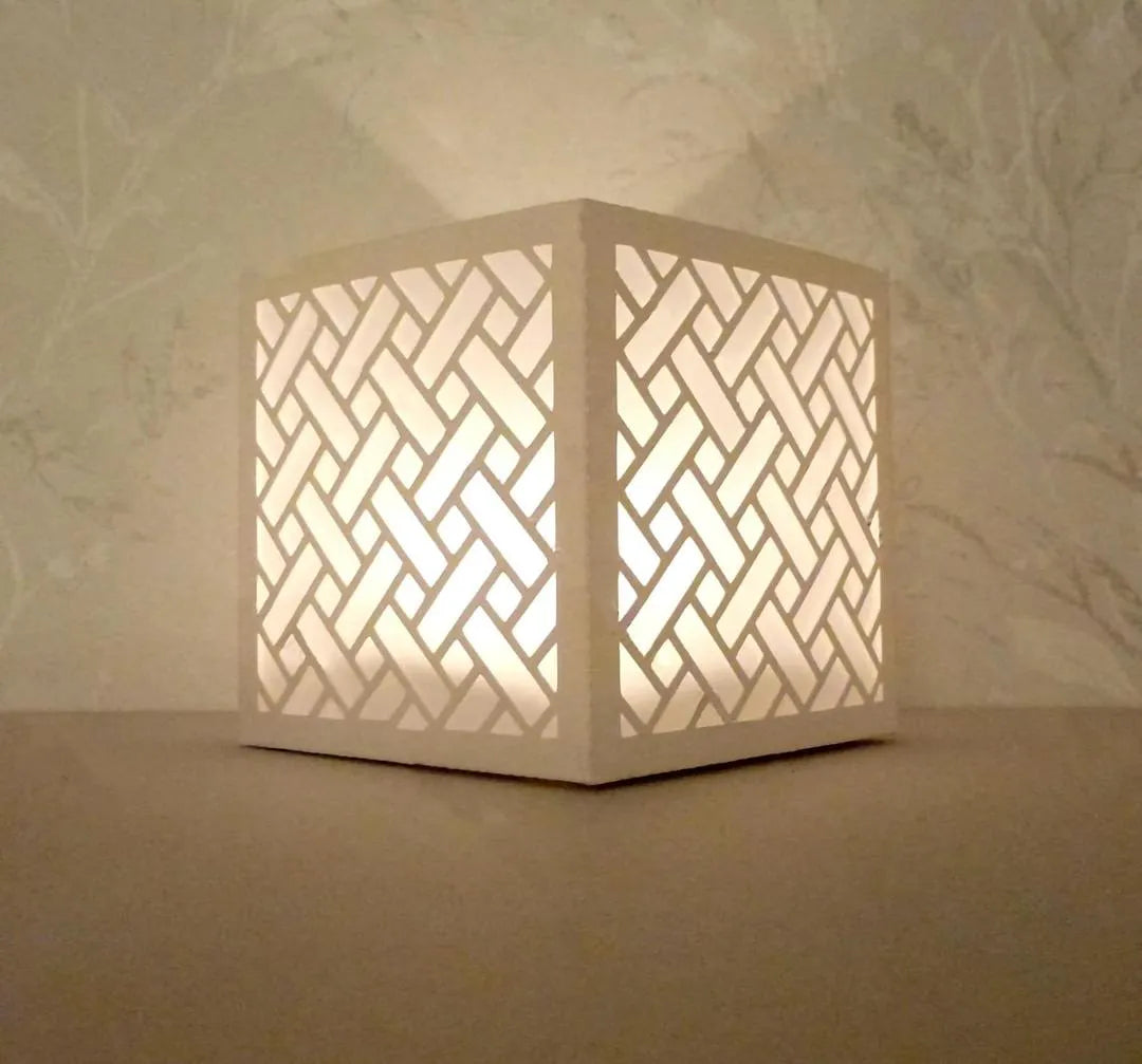 Modern White Geometric Tea Light Lamp with Golden Glow