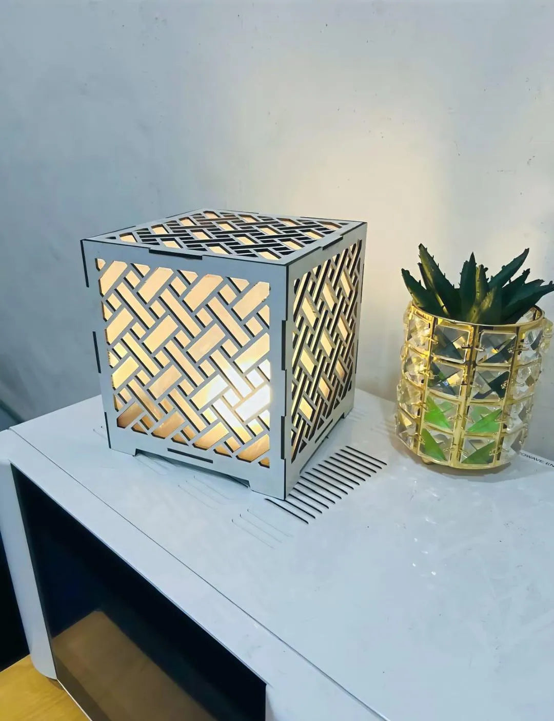 Modern White Geometric Tea Light Lamp with Golden Glow
